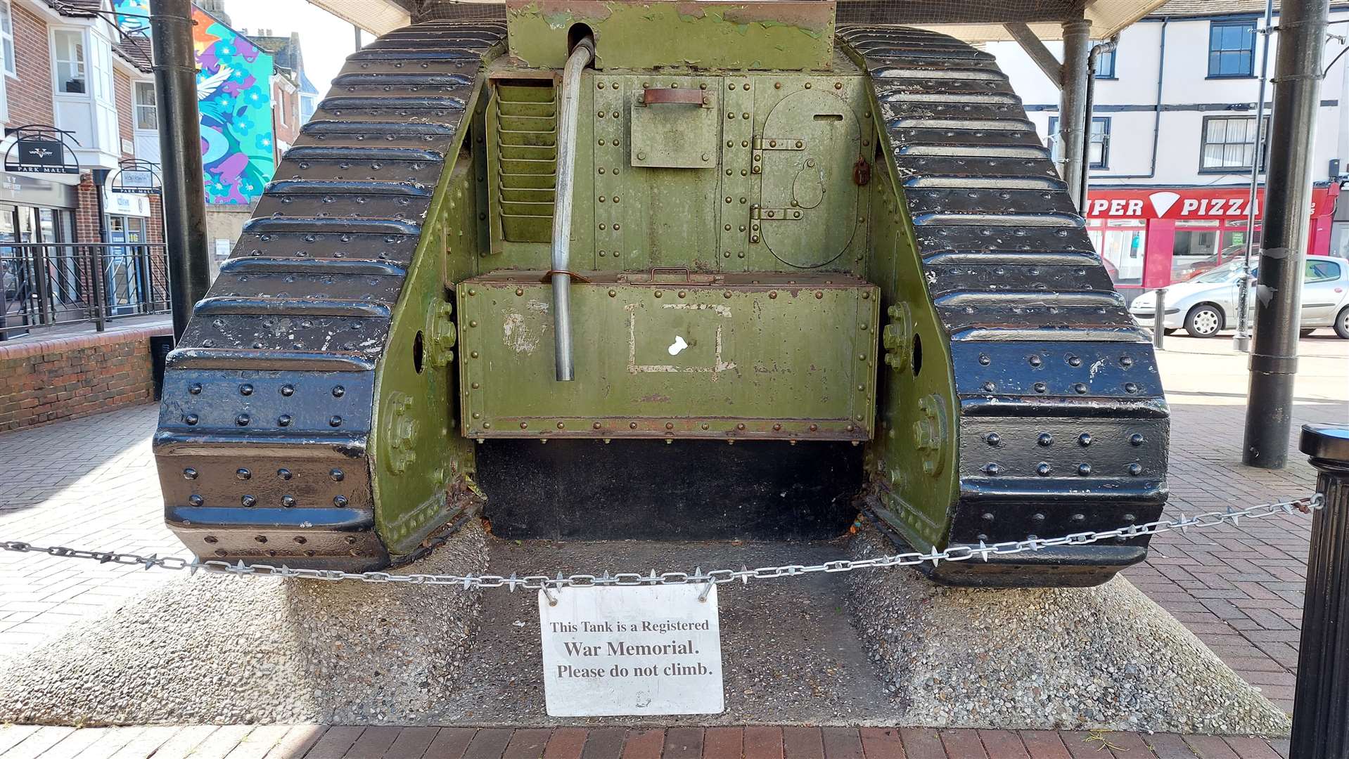 A sign is in place reminding children not to climb on the tank
