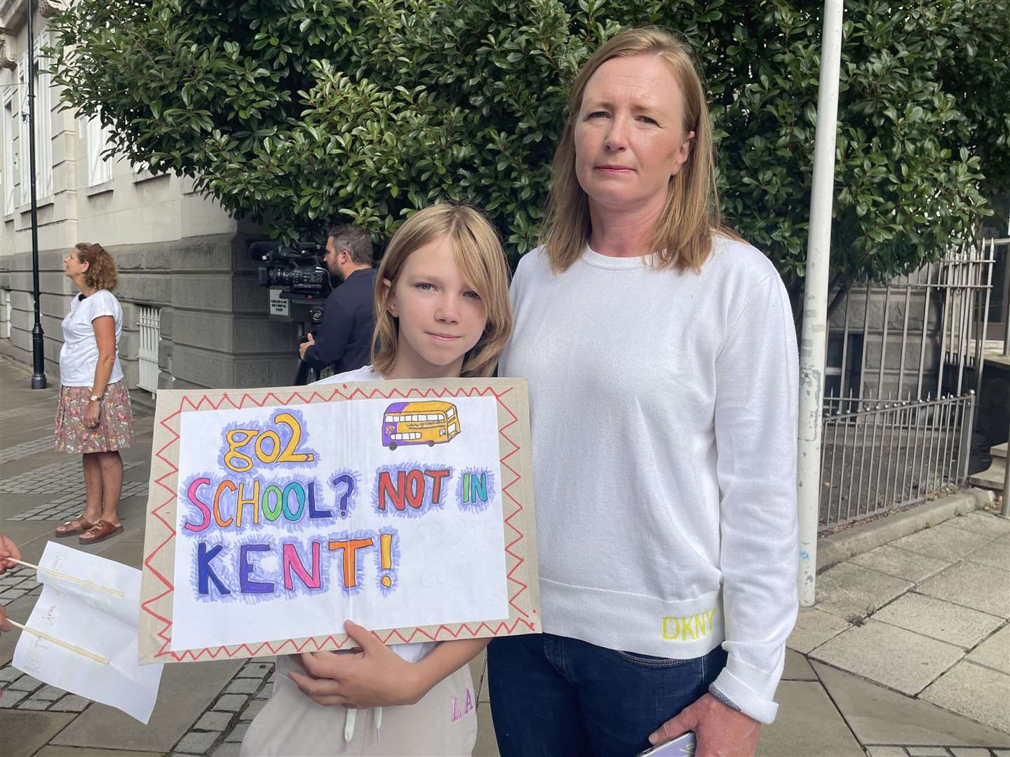 Jane Sinclair, right, and her daughter were outside County Hall in Maidstone to protest against bus cuts