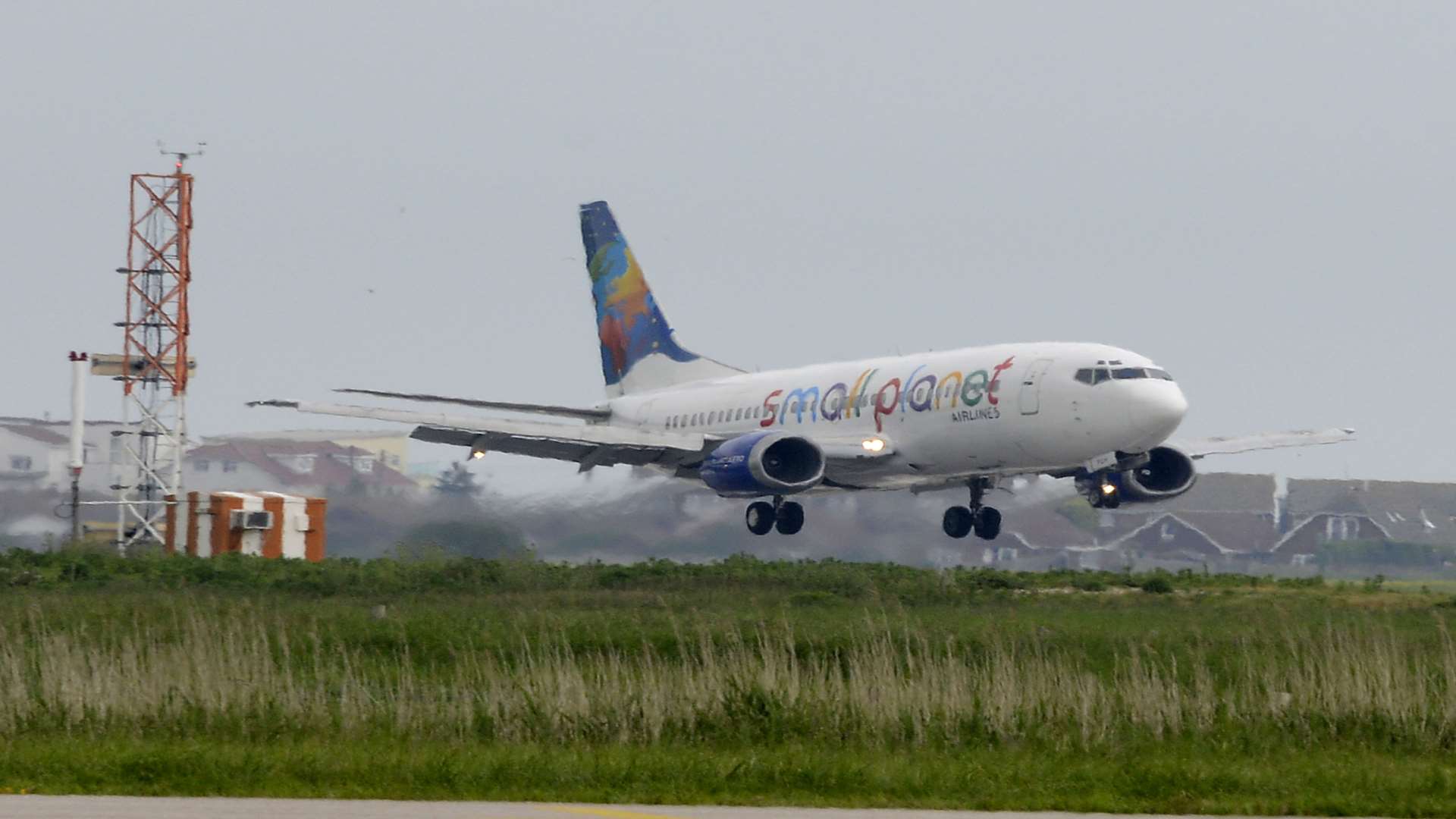 The first passenger airliner touches touches down at Lydd in June 2014