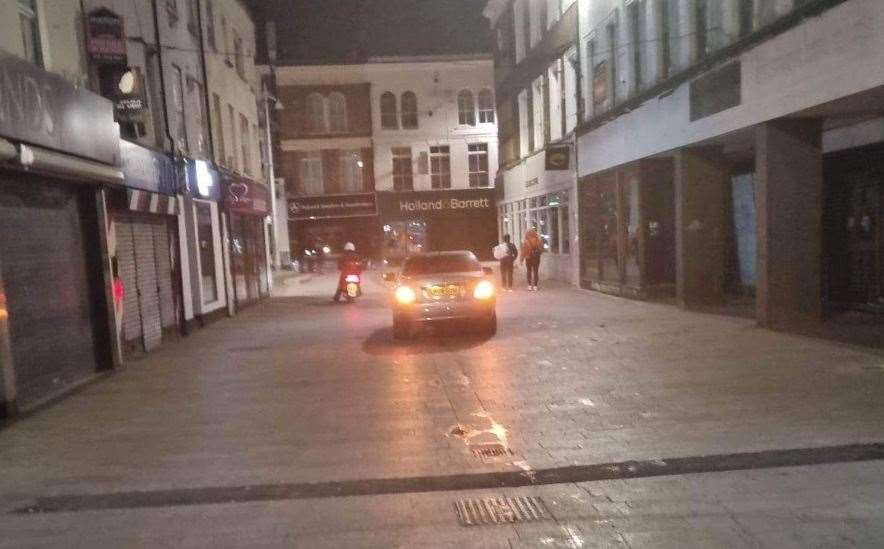 A car and a bike in the pedestrian-only zone in Dartford High Street
