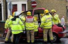 Firefighters and Ambulance staff work to free the woman from her car, which was involved in a collision with another vehicle at the junction of Winstanley Road and Alma Road