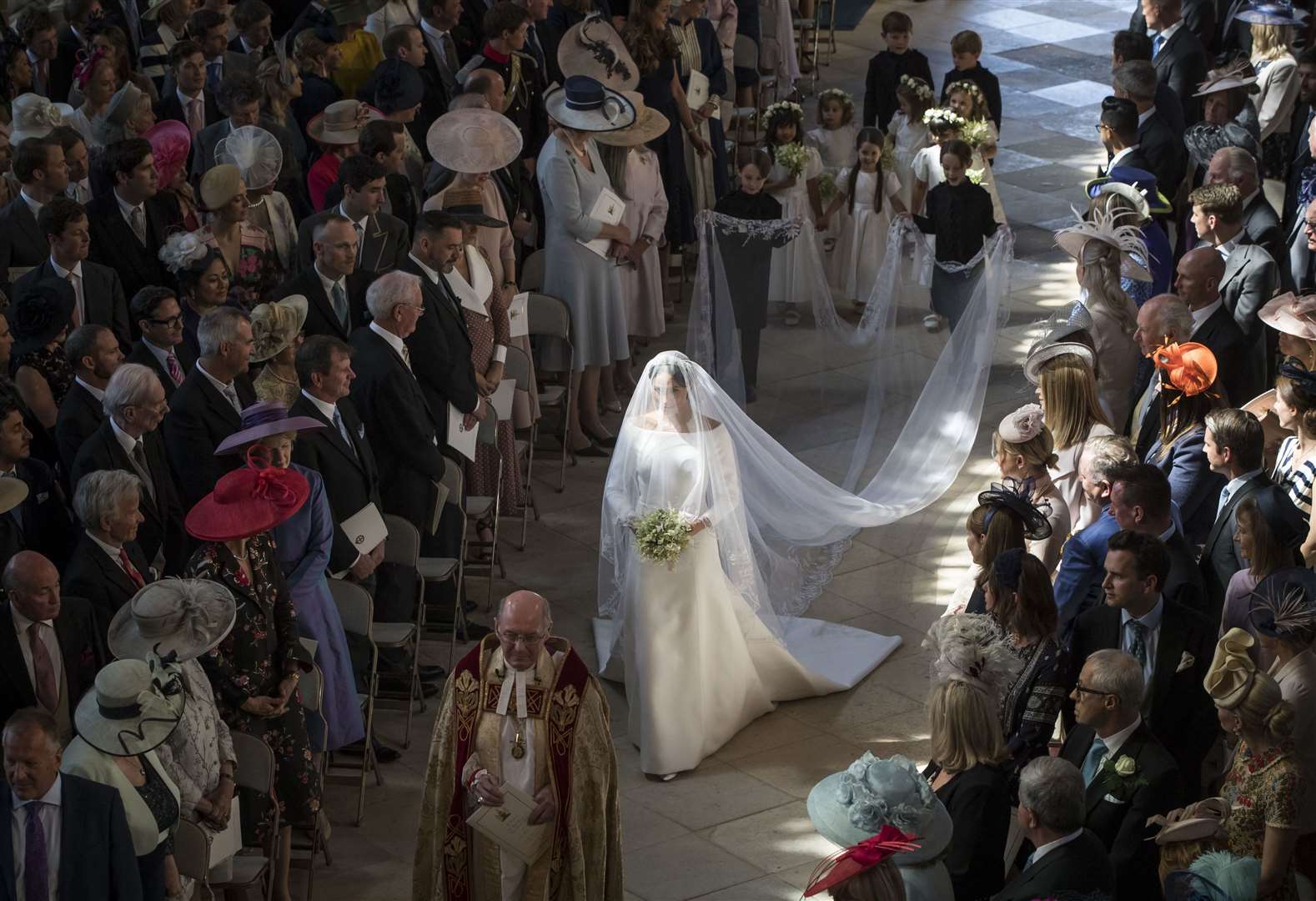 Meghan walks down the aisle as she arrives in St George’s Chapel (Danny Lawson/PA)