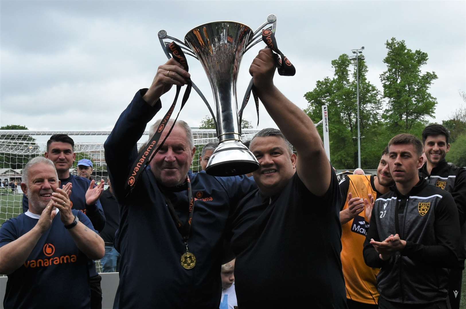 Assistant boss Terry Harris and manager Hakan Hayrettin with the National South trophy Picture: Steve Terrell