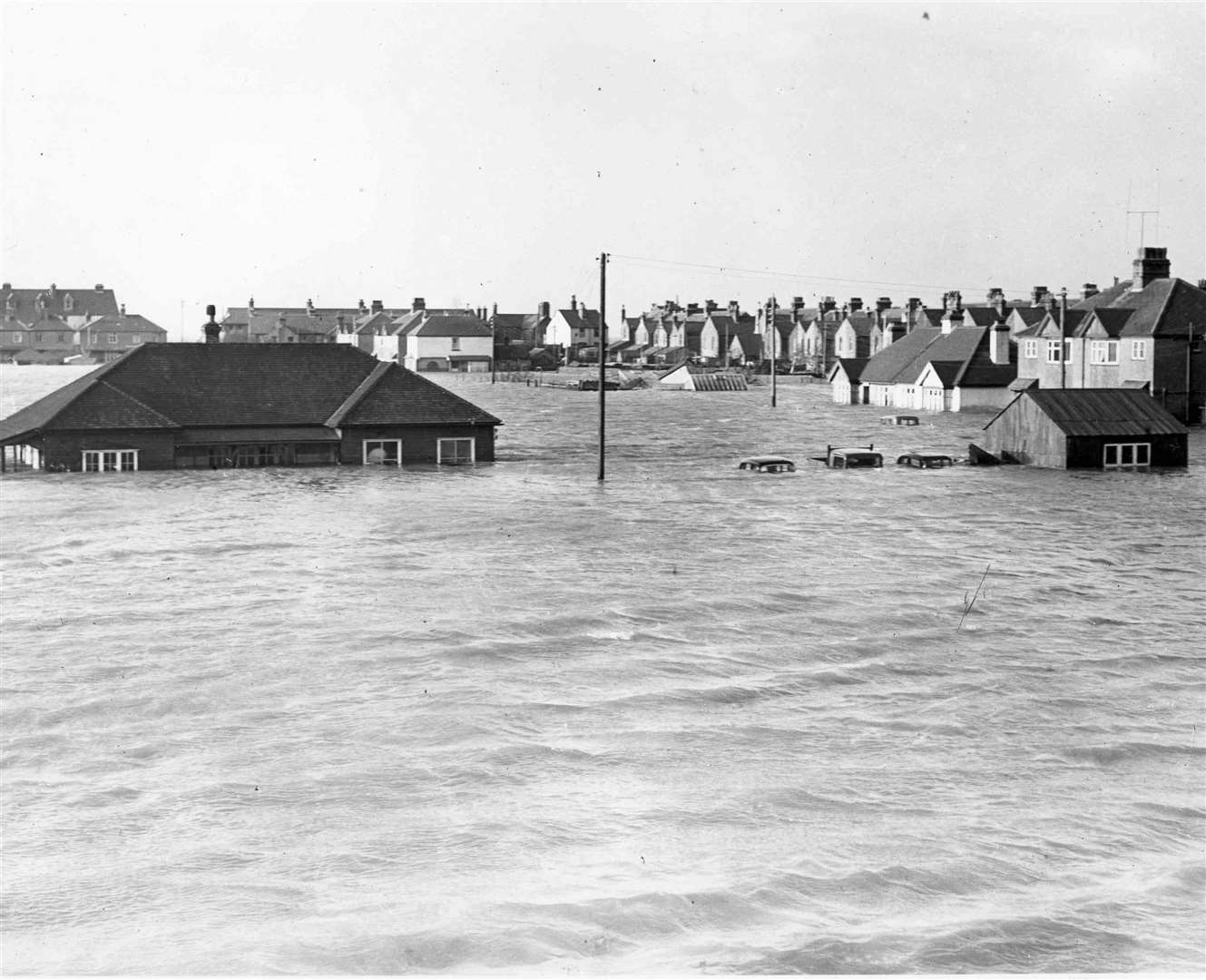 Cars left outside Whitstable Golf Club were nearly submerged by the rush of water in February 1953