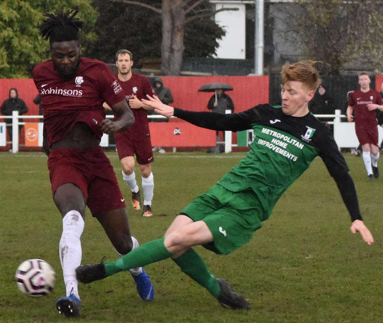 Cray Valley slide in against Canterbury in their FA Vase semi-final first leg. Picture: Alan Coomes