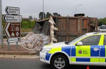 A lorry load of waste paper overturns outside Herne Bay