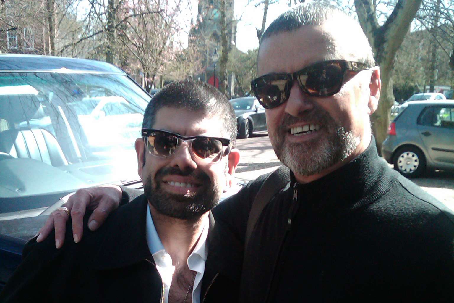 Saf Sathi from Rochester poses with his idol, George Michael