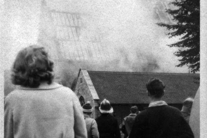 Onlookers stare at the scene of devastation 50 years ago