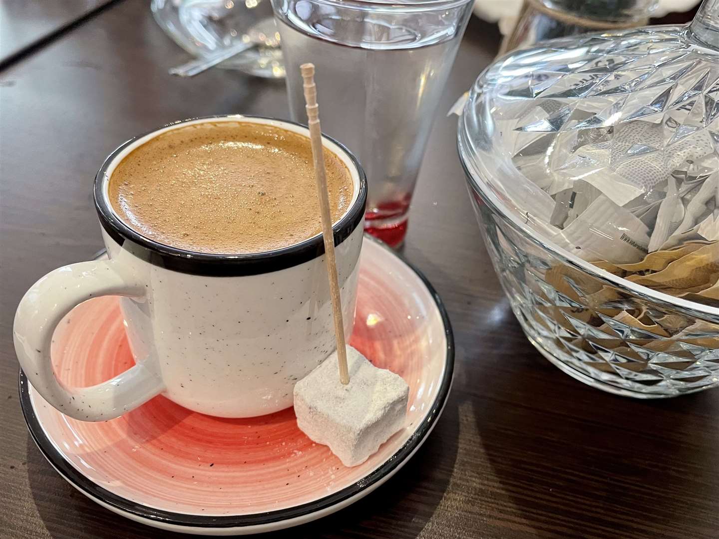 Turkish coffee, served with a cube of Turkish delight