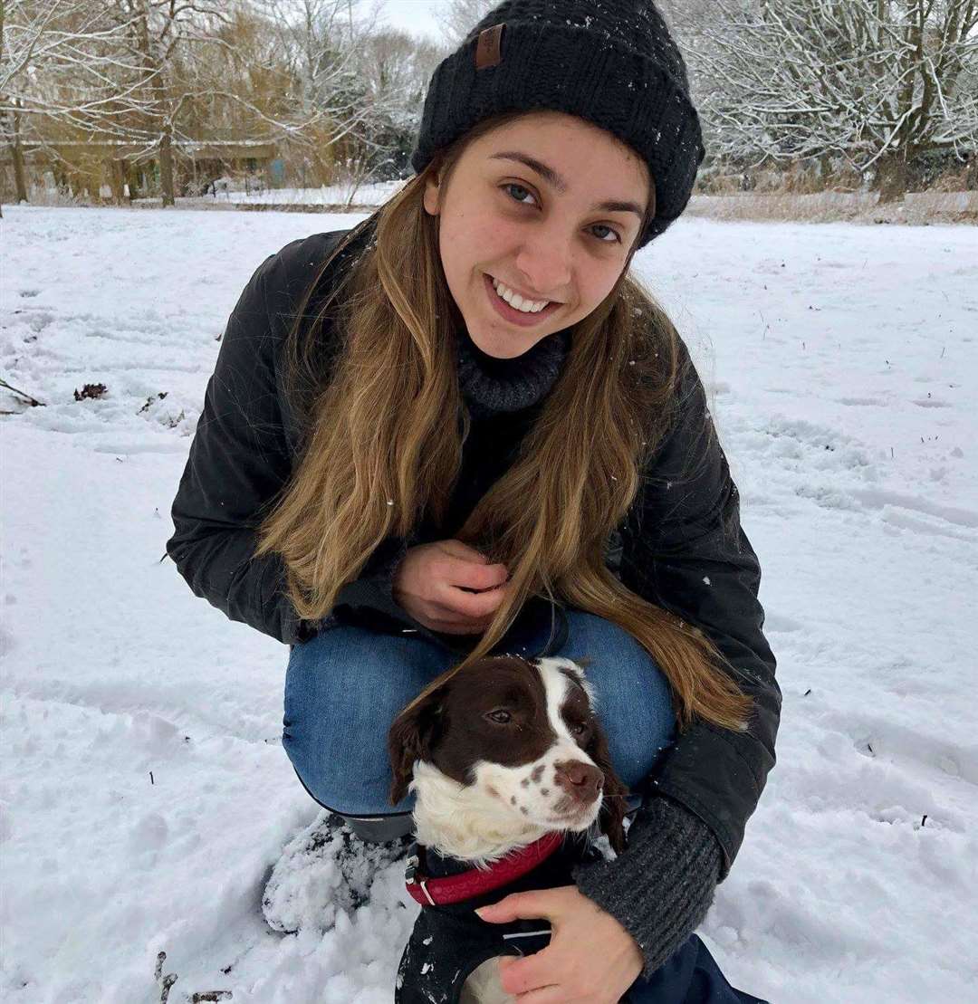 Isabella with her service dog, Tilly, in winter 2018. Picture: Abigail Goddard