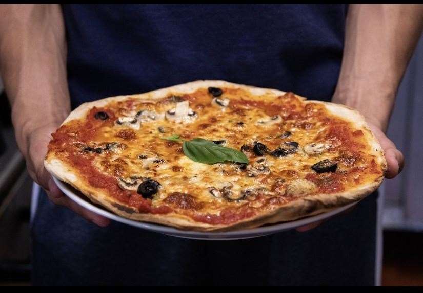 The restaurant recently added pizzas to their menu