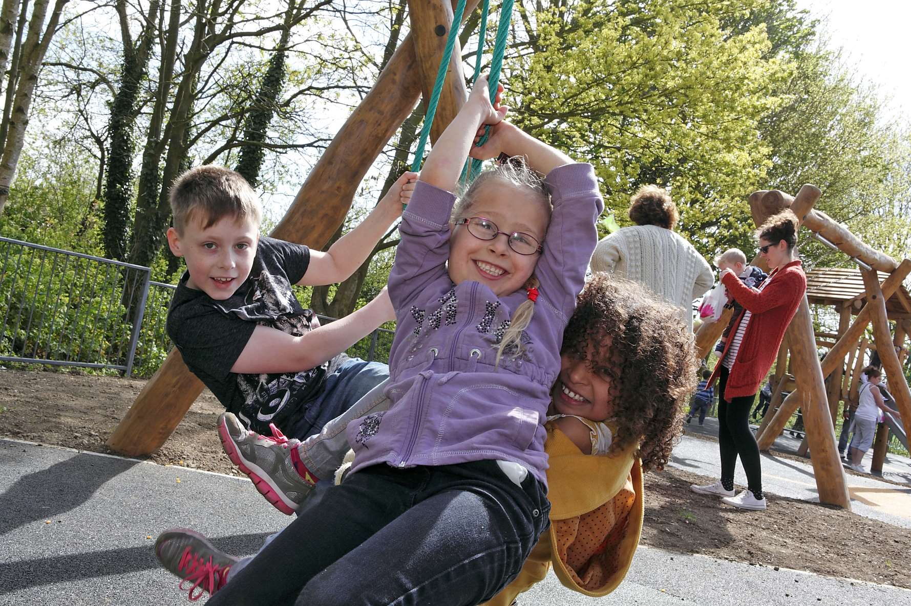 Taylor-Louise, 6, Frank, 7, and Abbi, 8, enjoy playing on the new playpark. Picture: Simon Kelsey.