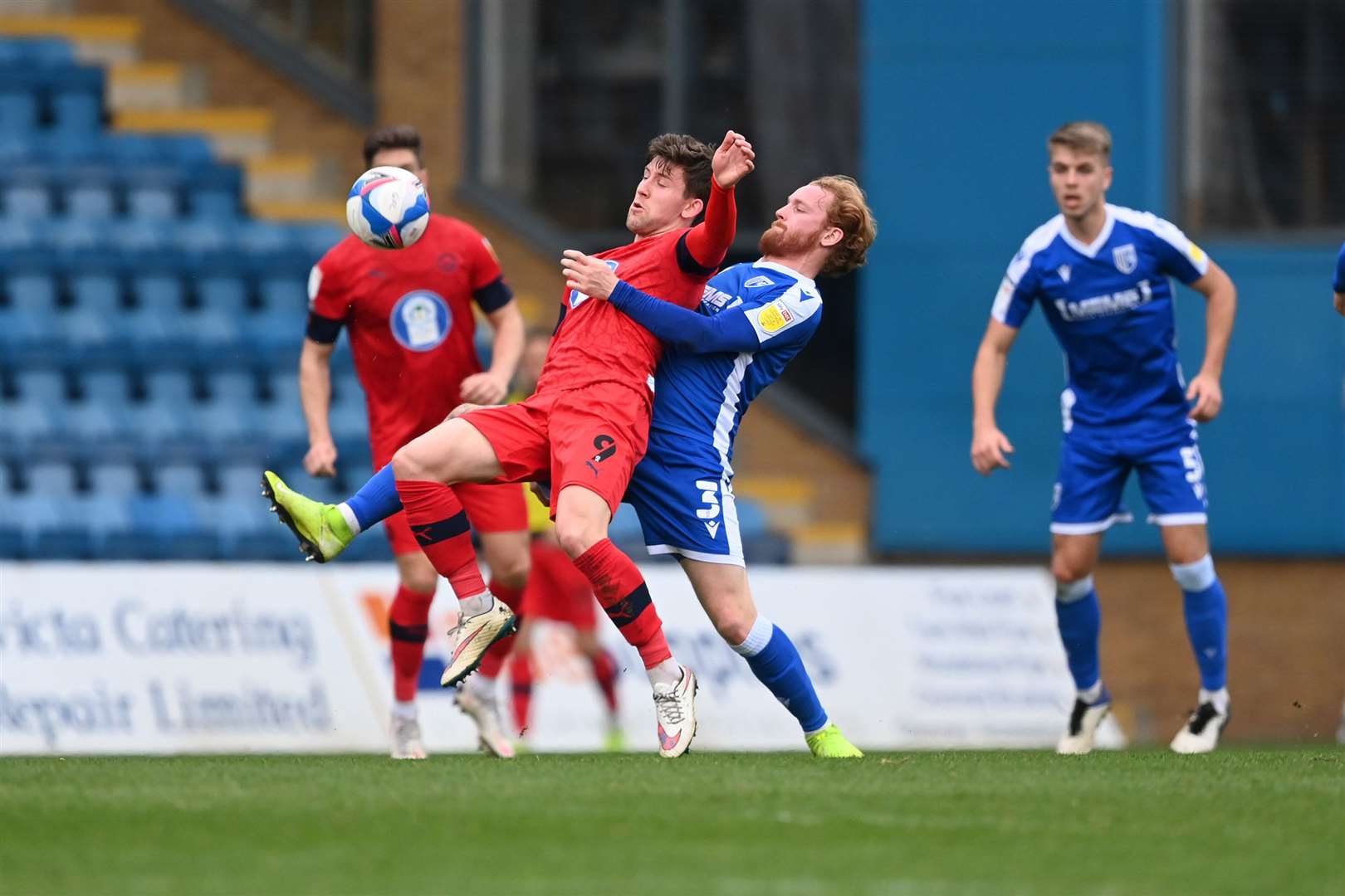 Connor Ogilvie challenges Callum Lang for the ball