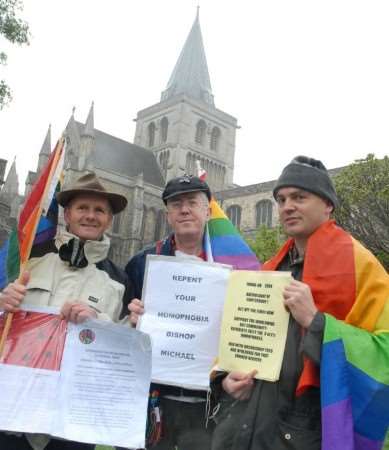 Protesters Peter Cronin-Hill, Ray Duff and Chris Weller outside Rochester Cathedral.