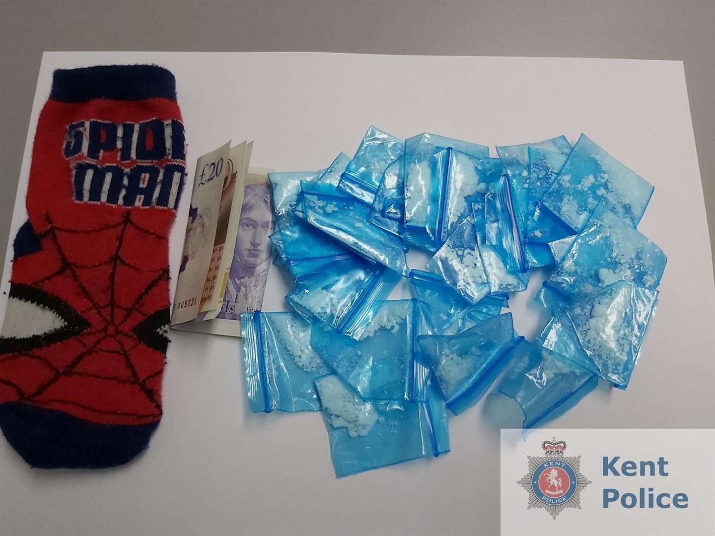 A police dog sniffed out £3,000 worth of cash and class A drugs hidden in a Spider-Man sock. Picture: Kent Police