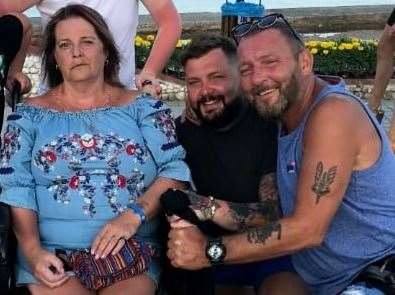 Luke Sullivan, centre, pictured on holiday with his parents Tania and Wayne