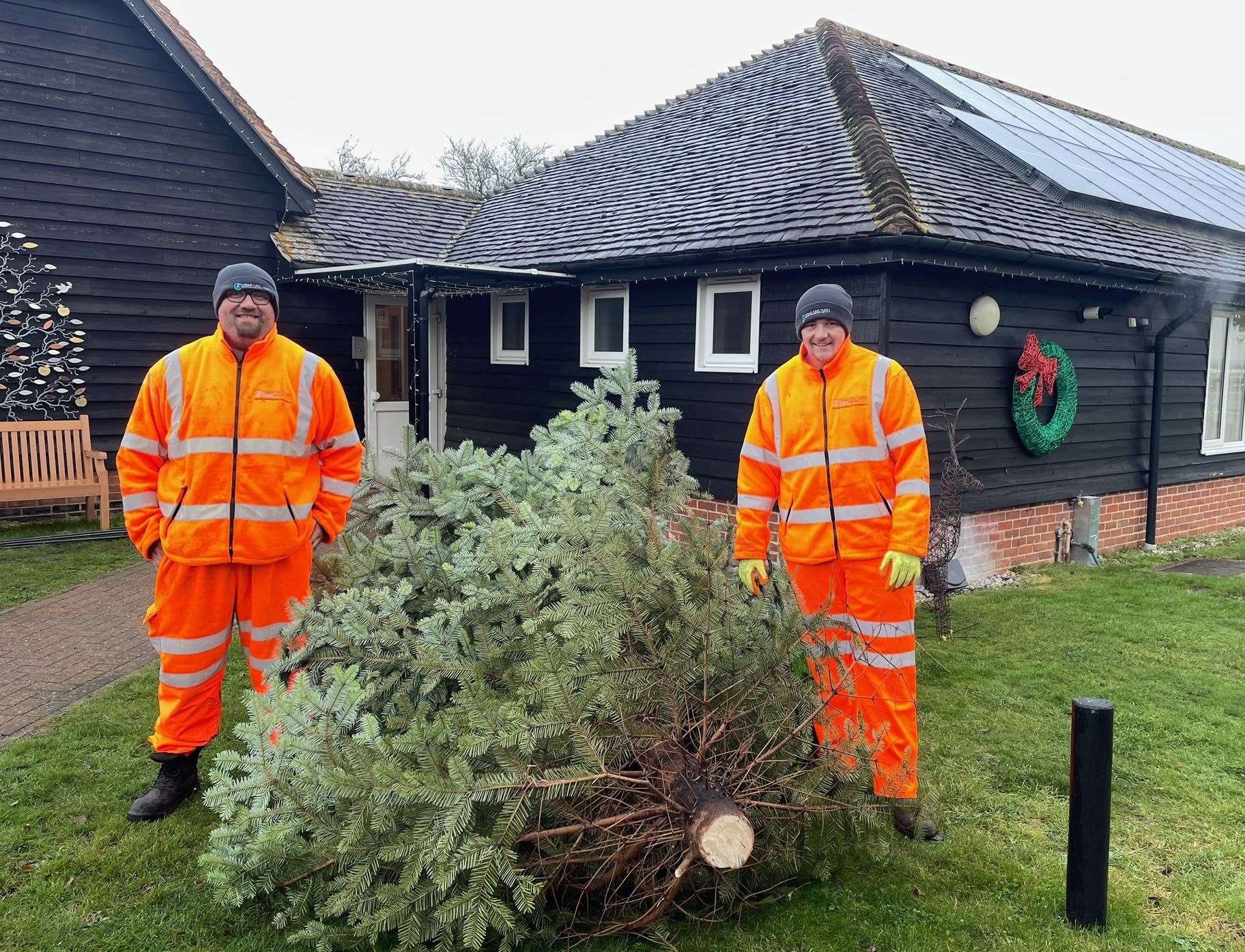 Road Rail Plant’s Liam and Leo with the tree they delivered from Milton Regis to Demelza’s base in Bobbing after Hannah’s appeal for help getting it there