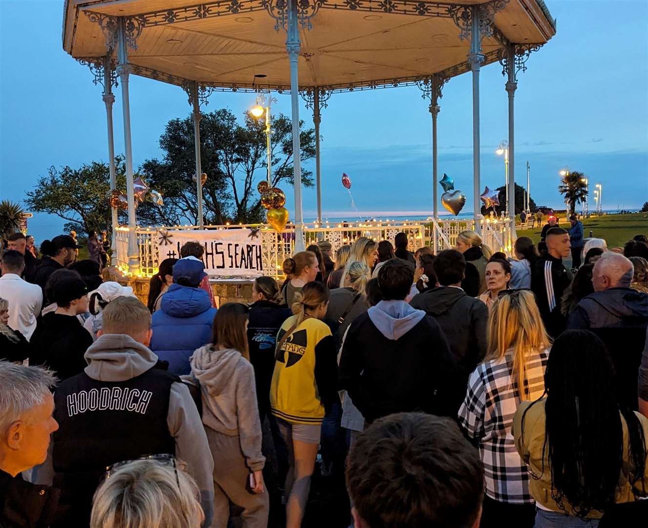 Hundreds of mourners have gathered at The Leas bandstand to remember Leah. Picture: Rhys Griffiths