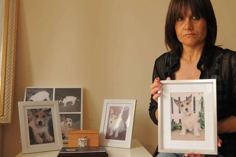 Samantha Ripley with pictures of Shelby who was killed