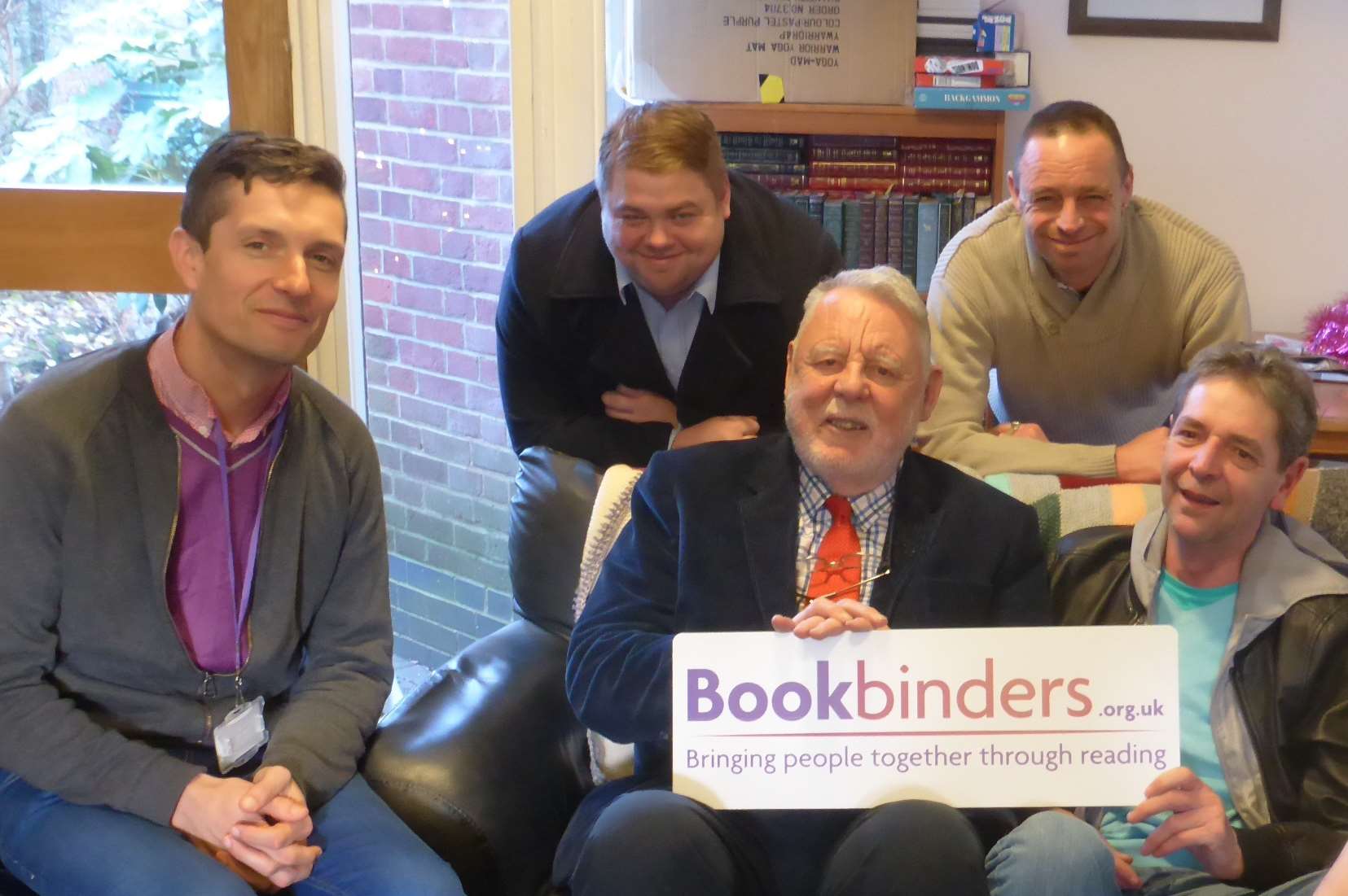 Terry Waite meets staff and clients of Porchlight to talk about Bookbinders, a KM Charity Team initiative to boost reading levels of vulnerable groups.