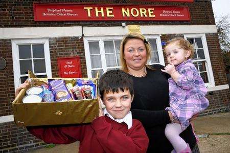 James outside The Nore, with mum Amanda Taylor and sister Lyla Taylor, two