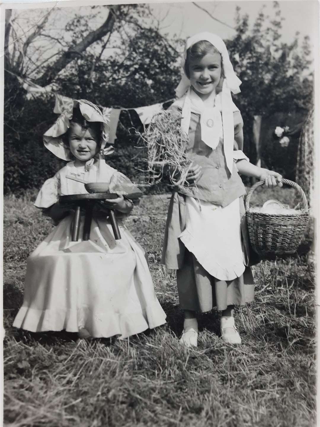 Historic photo of Heather Littlewood, left, nee Drowley and her sister Pauline Day dressed as Little Miss Muffet and the Ovaltine lady to mark the Queen's coronation in 1953