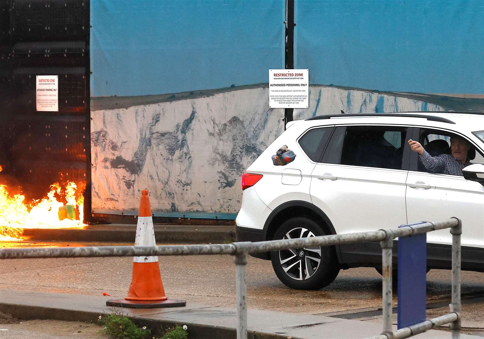 The suspect throws a petrol bomb at Tug Haven Picture: Reuters/Peter Nicholls