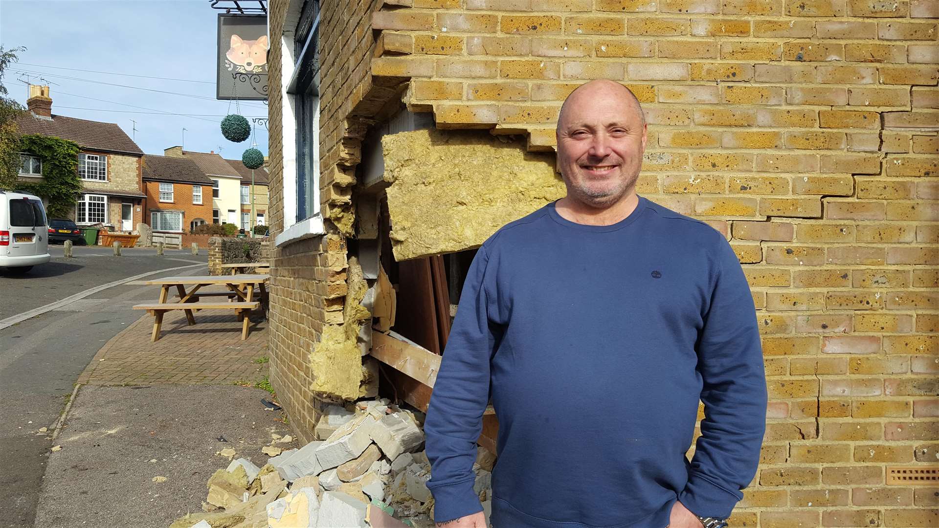 Landlord Michael Hawney was in good spirits, even making jokes, as the car was finally removed