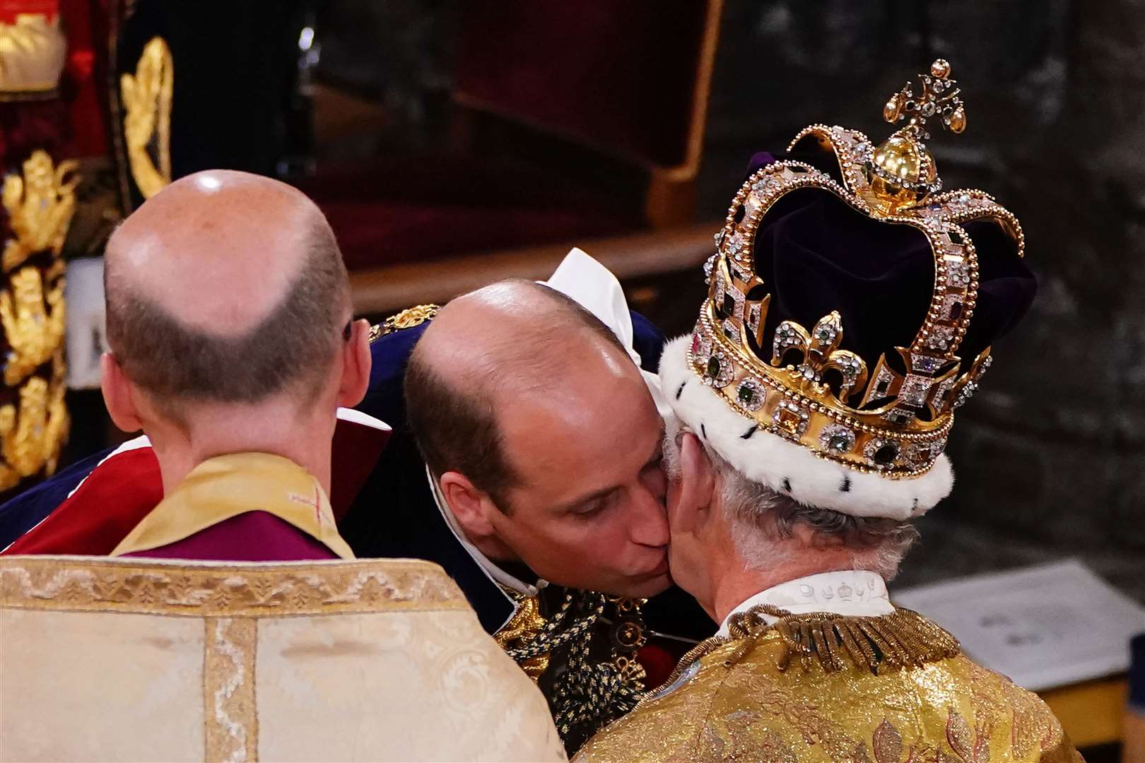 The Prince of Wales kisses his father the King during the coronation ceremony at Westminster Abbey (Yui Mok/PA)