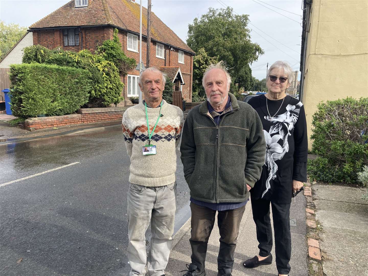 Cllr Tony Winckless, left, and residents Bill Francis and Julie Glass near the water leak in North Street, Milton Regis
