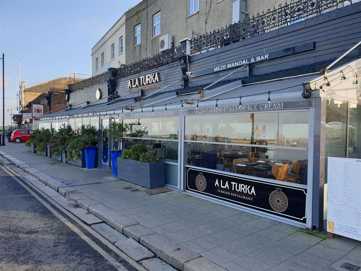 The glass panels enclosing the outside seating area were erected in 2019 without planning permission