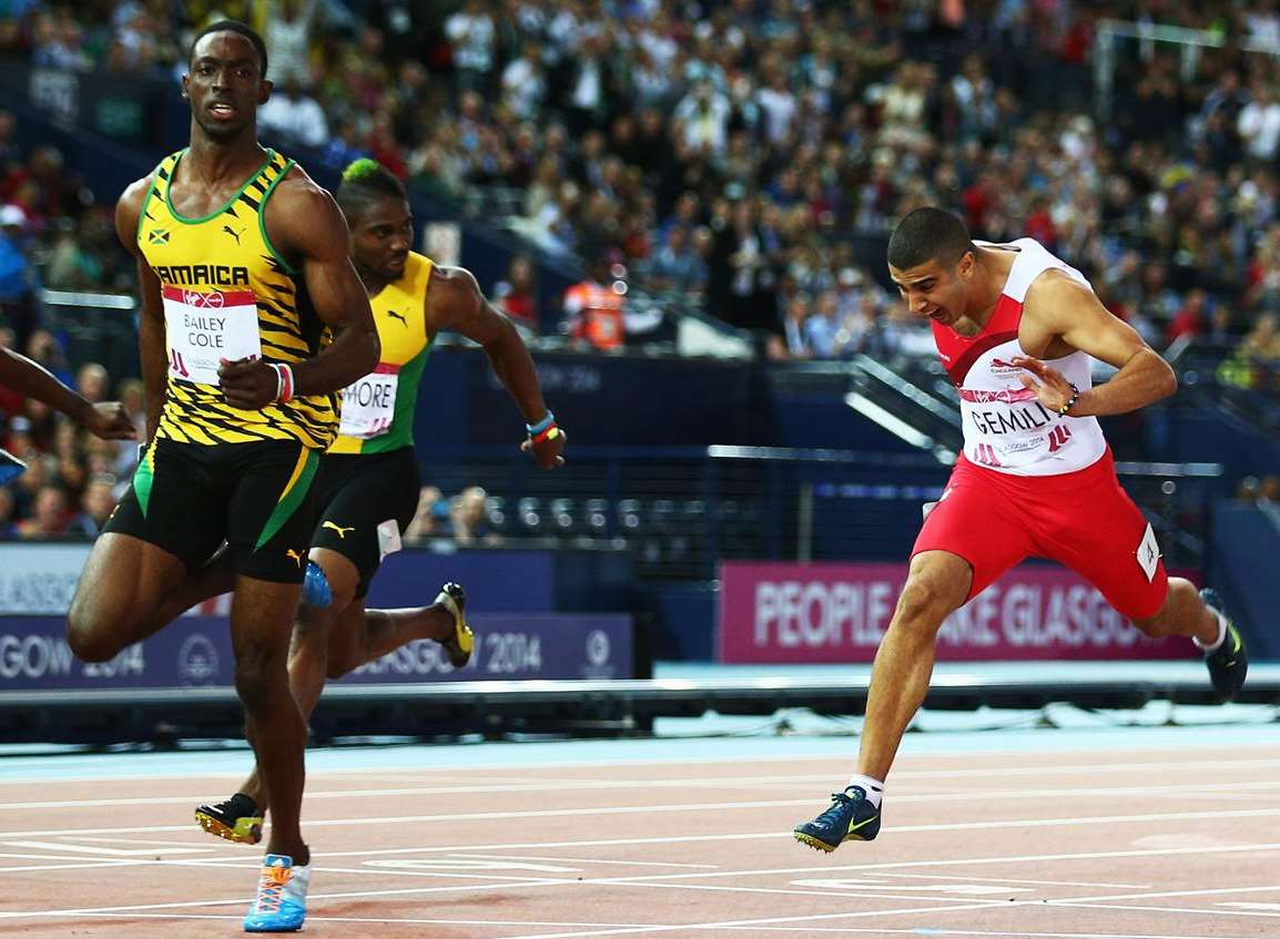 Kemar Bailey-Cole of Jamaica crosses the line to win gold ahead of Adam Gemili, right, in the 100m final at the Glasgow 2014 Commonwealth Games. Picture: Ian Walton/Getty Images