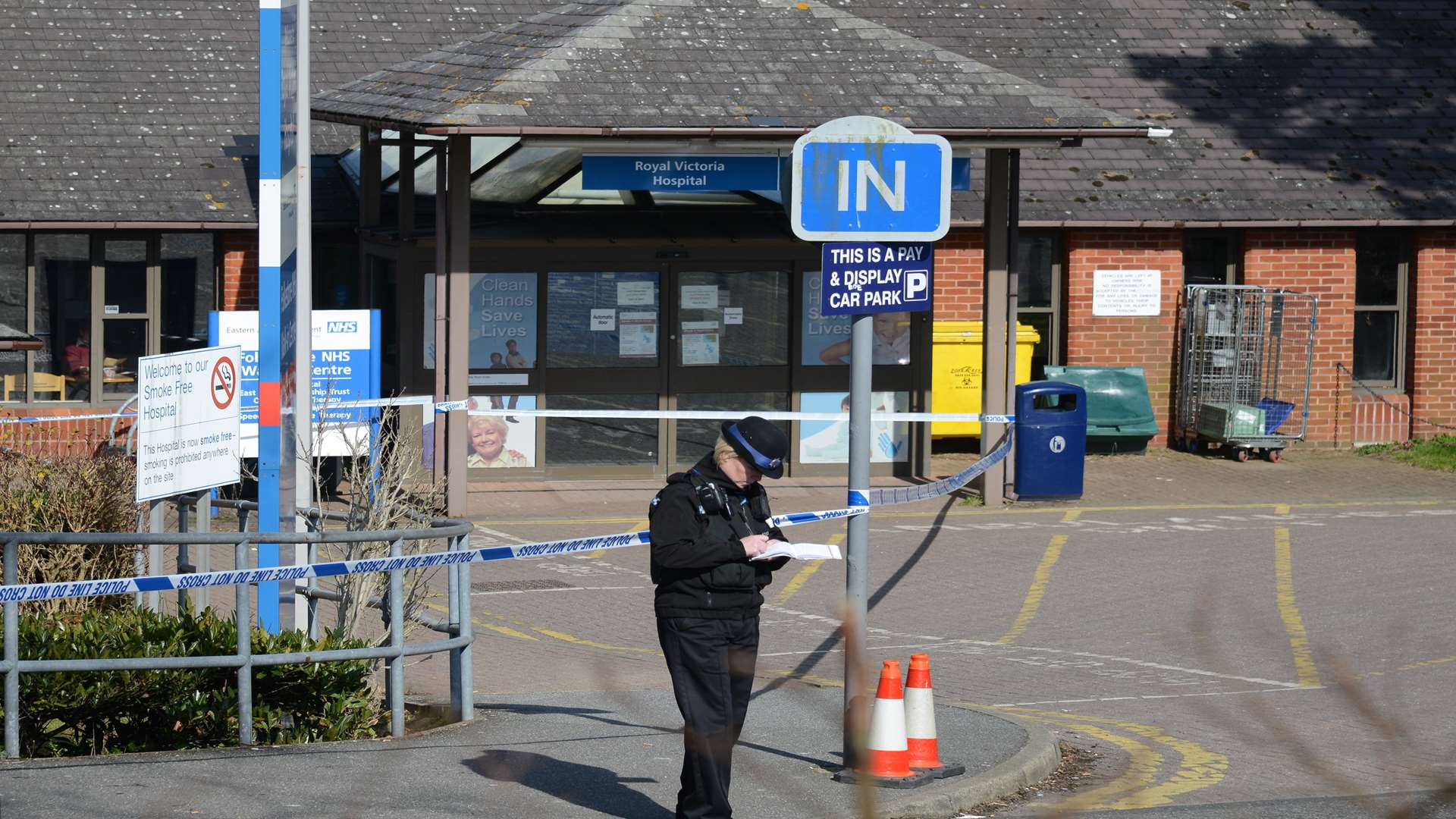 Police stood guard outside the Royal Victoria Hospital after the man dragged himself to the hospital