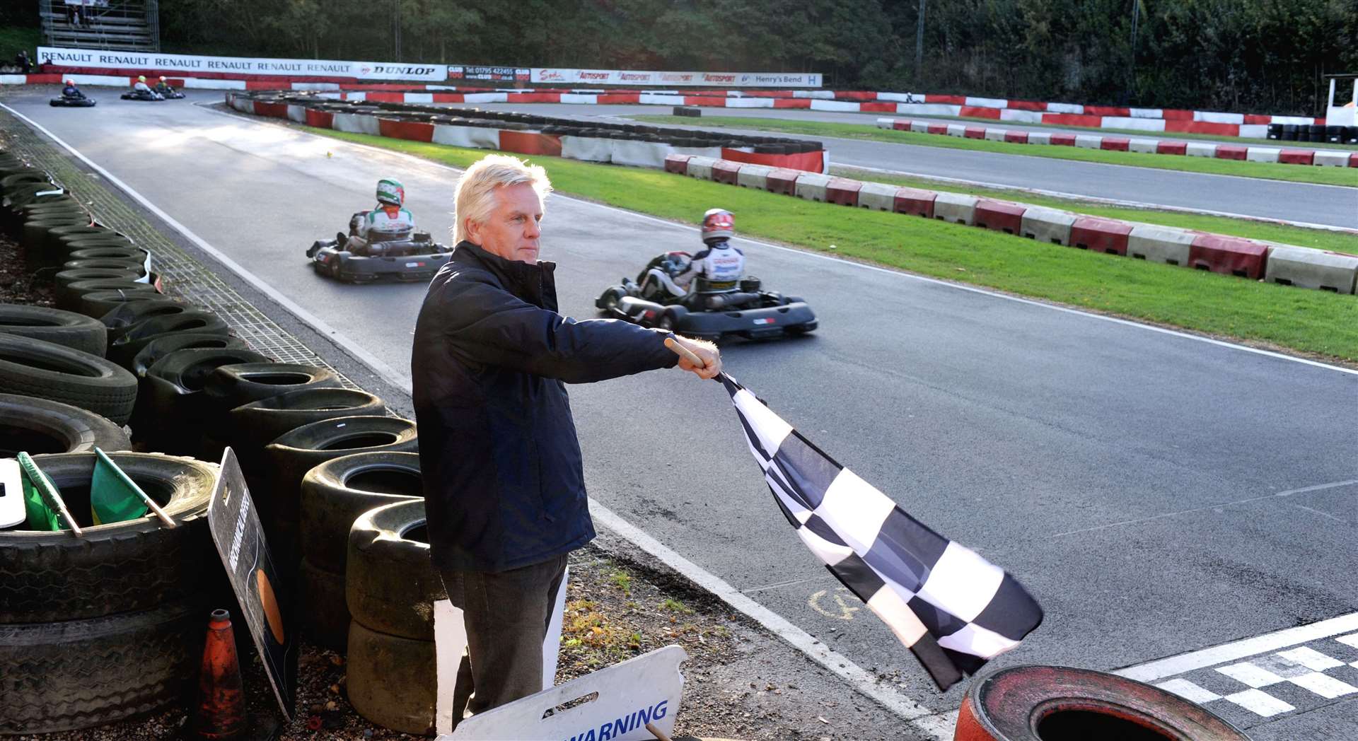 TV presenter Steve Rider waved the chequered flag at the end of the Henry Surtees Challenge final in October 2014. Picture: Simon Hildrew