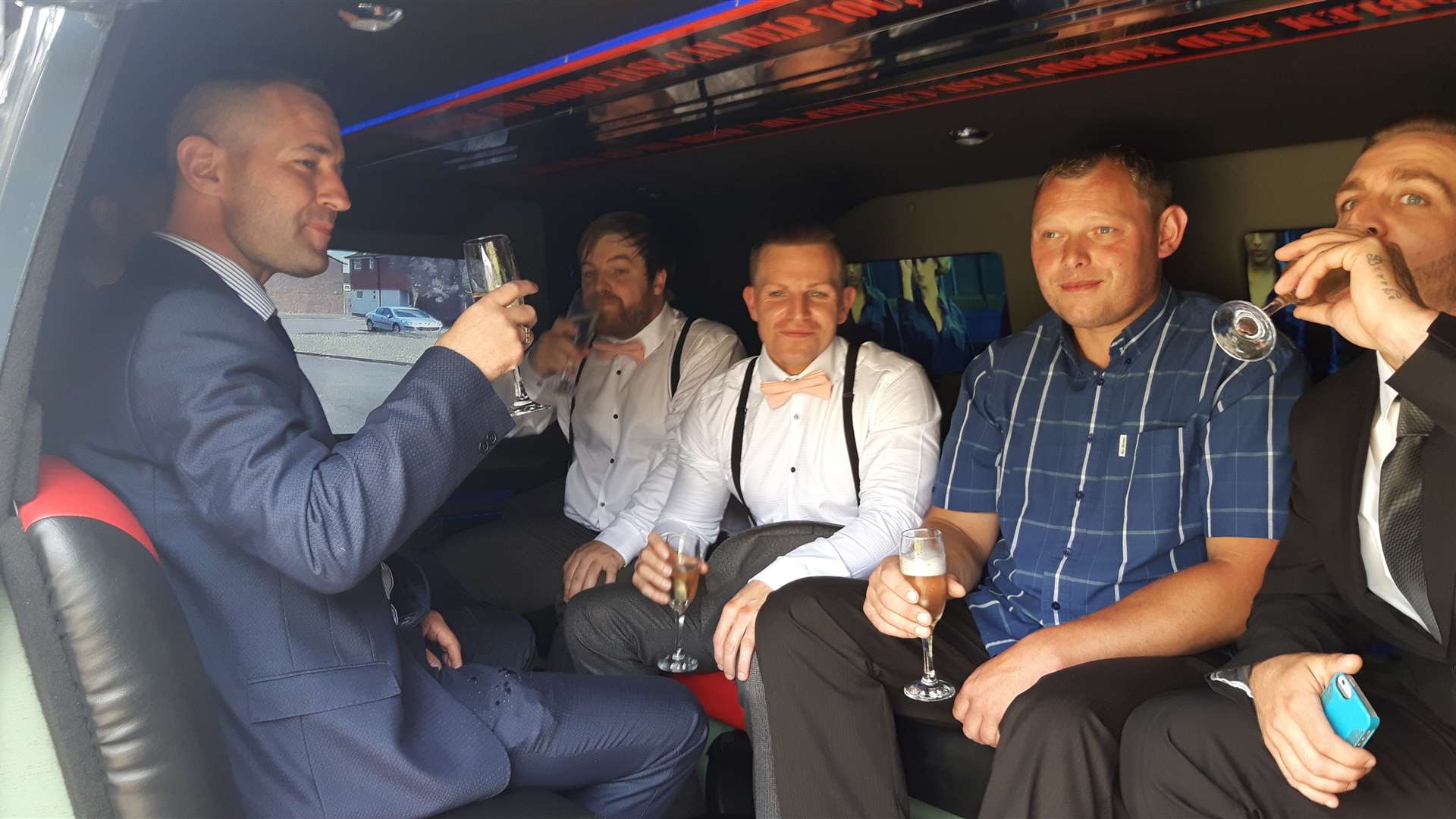 Asa and pals enjoy some champagne on their way in the A Team van