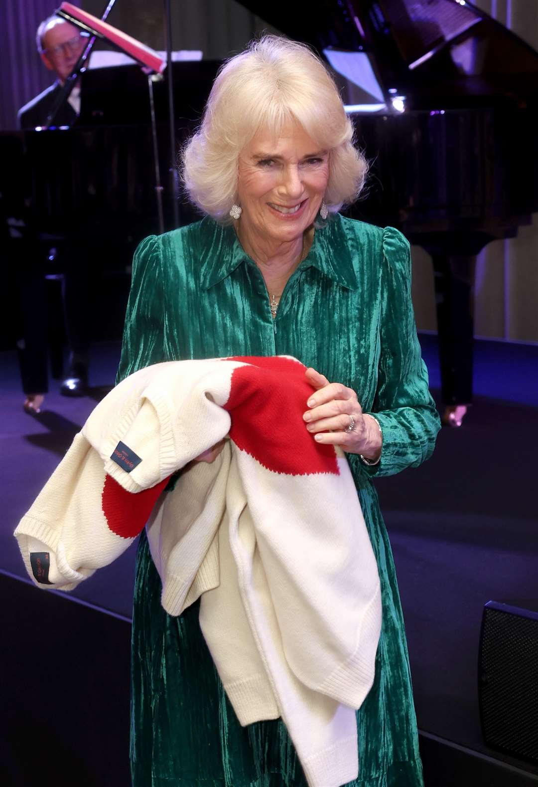 Queen Camilla smiles as she holds gifts of Valentine’s Day jumpers (Chris Jackson/PA)