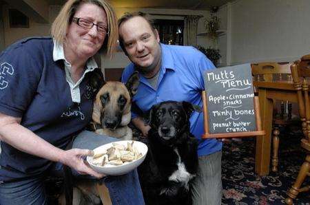 Nuala Brenchley-Sayers and David Thompson with Griff and Tetley, sampling the menu at The Wine Vaults in Faversham