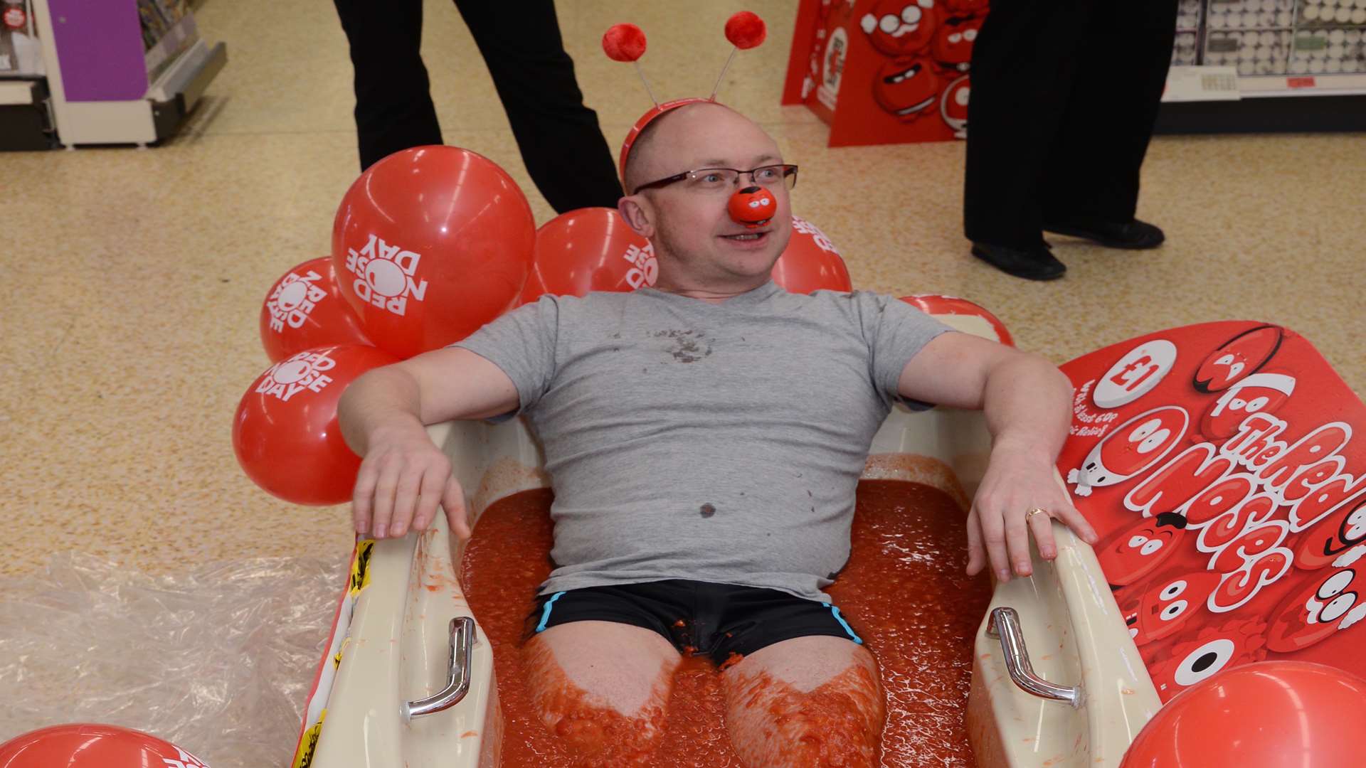 Simon Cadier is the first to brave a bathe in tomatoes