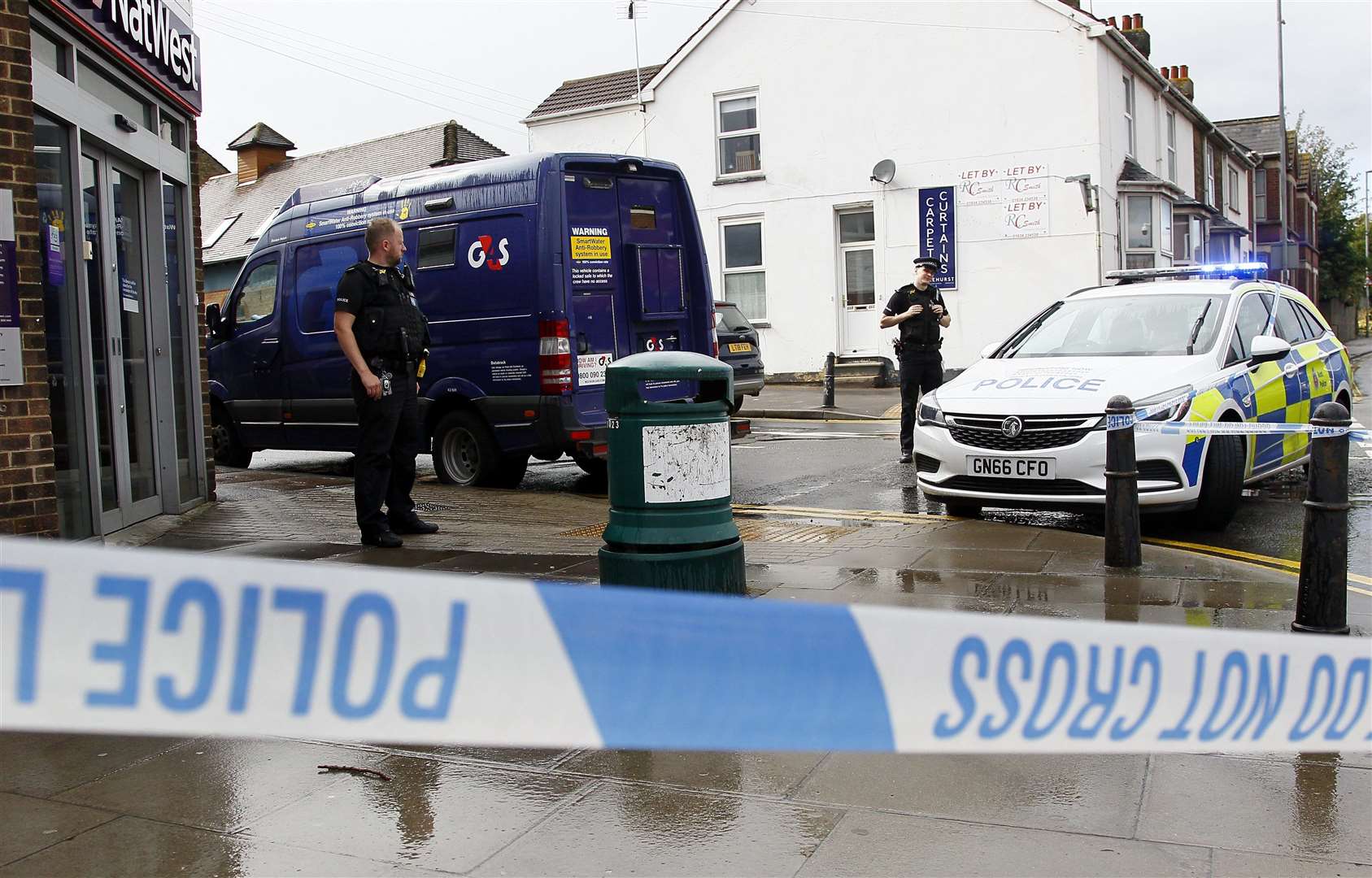 Police and the G4S delivery van at NatWest, in High Street, Rainham. Picture: Sean Aidan