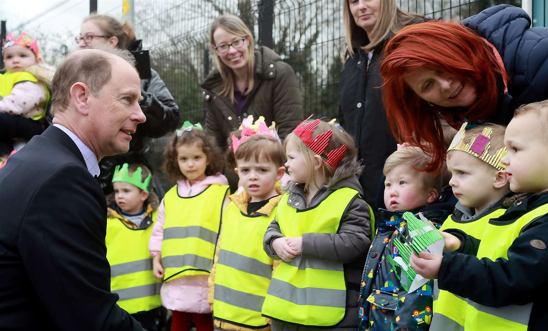 Children from the 2J's pre school welcomed Prince Edward to Gillingham wearing home-made crowns. Picture: Phil Lee
