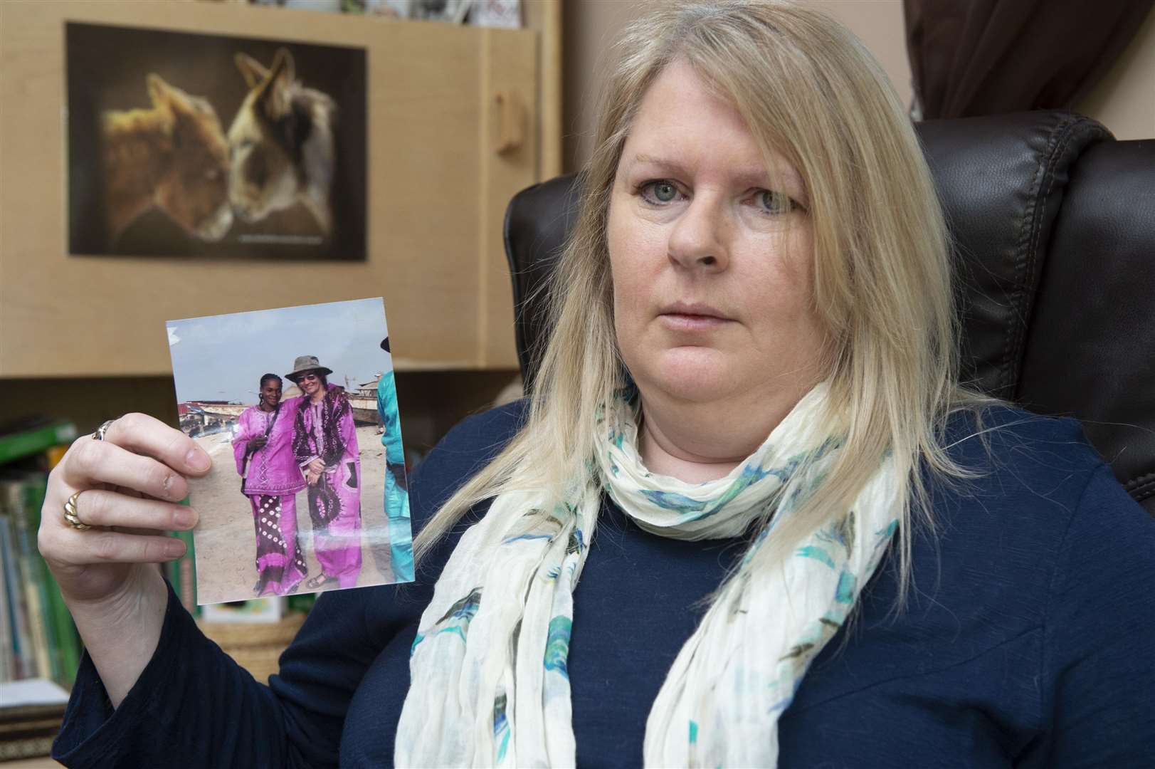 Elaine Kenley, of Coombe Road, Maidstone, with a picture of Jack and his Gambian wife Fatou, is asking Boris Johnson to intervene in her fight for justice after her brother Jack was murdered in The Gambia. Picture: Andy Payton