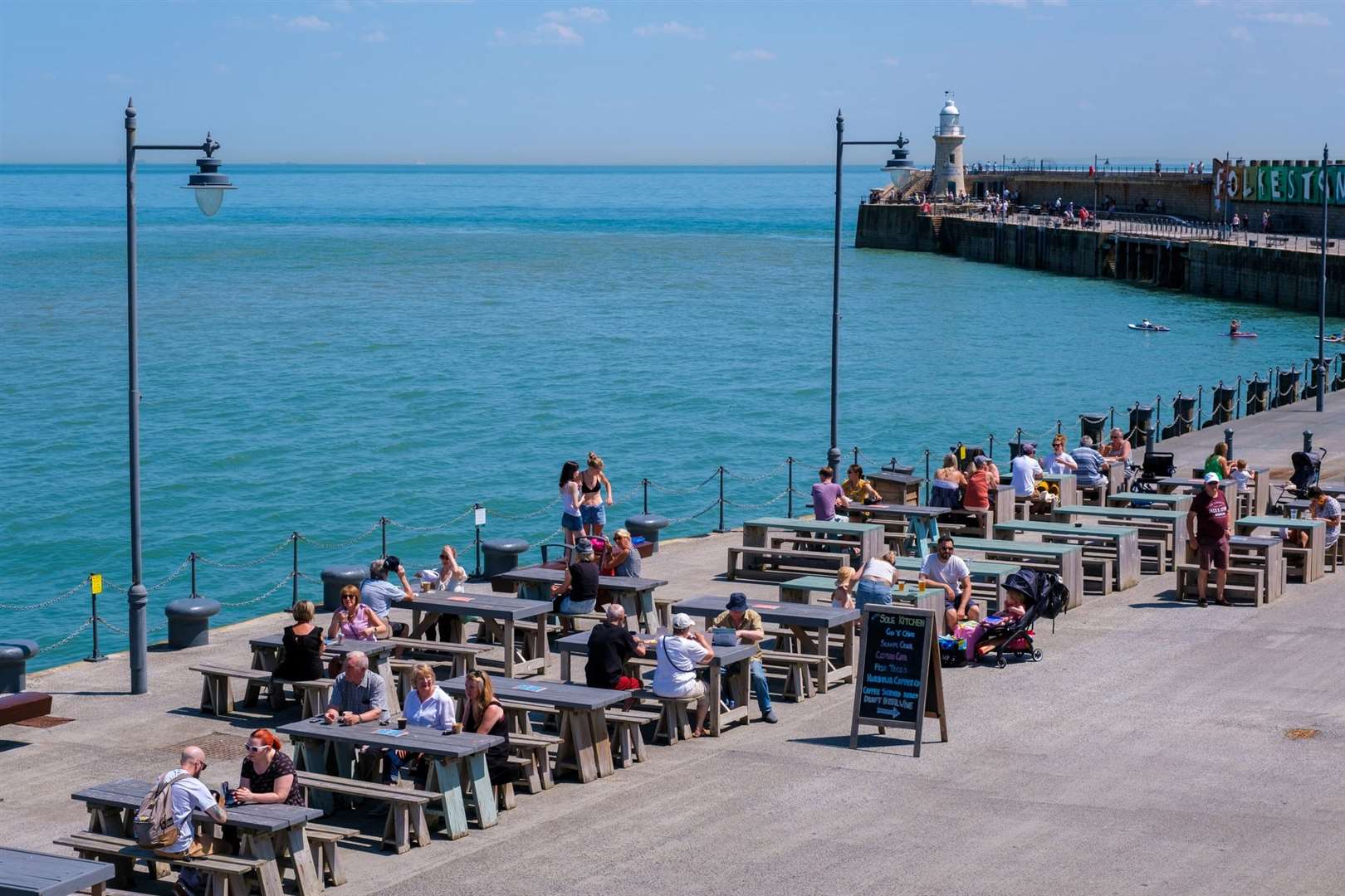The outdoor dining terrace at Folkestone Harbour Arm. Stock picture