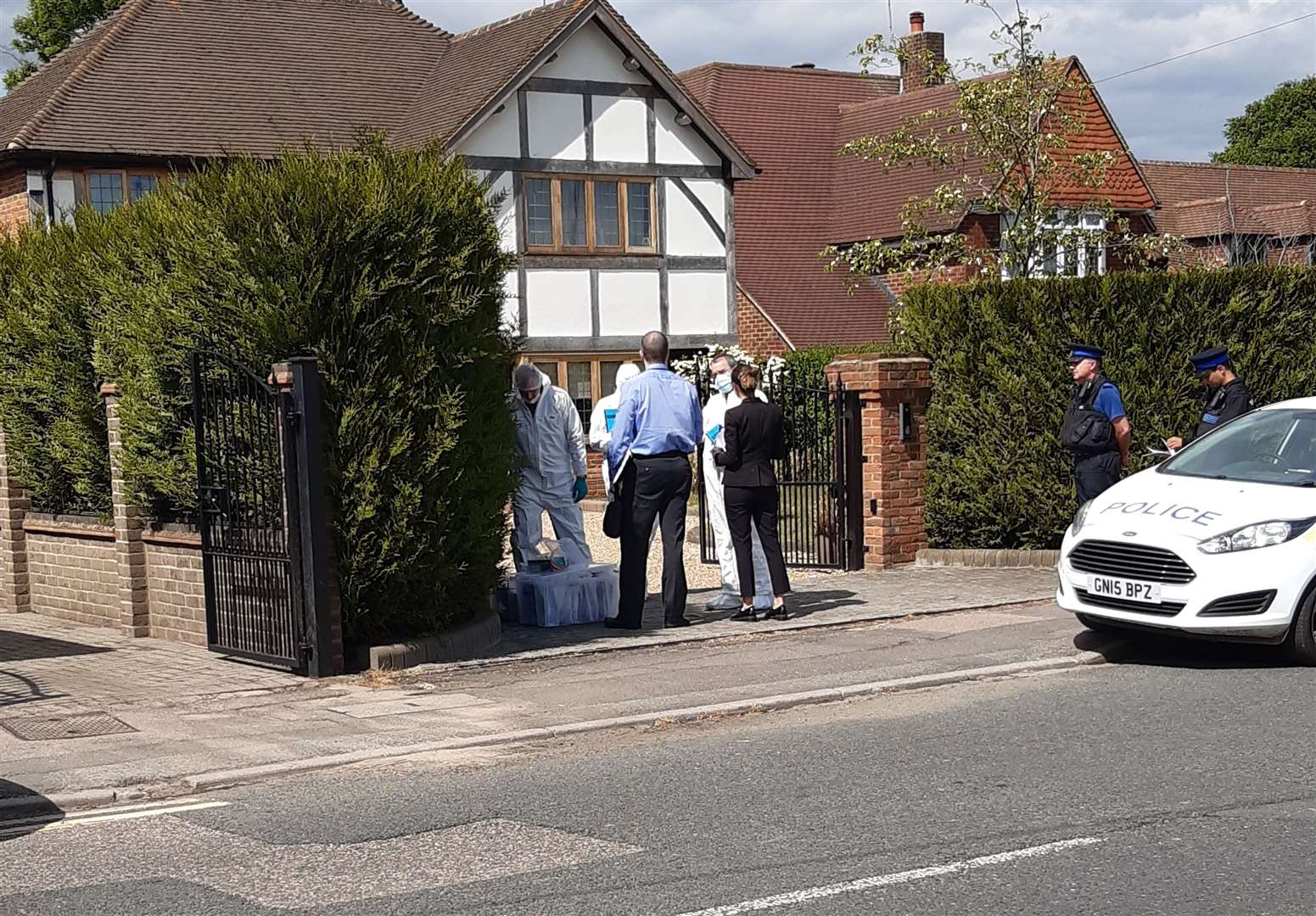 Forensic teams at the house in Oakfield Lane in Dartford where a man was found dead with stab wounds. Picture: UKNip