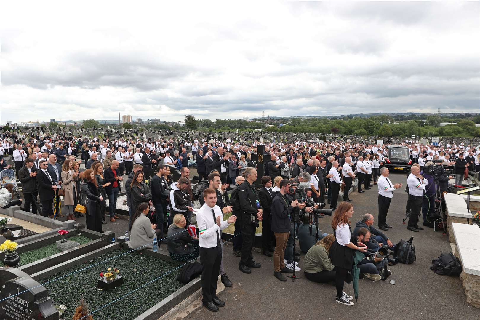 A large crowd listens to an oration by former Sinn Fein president Gerry Adams at Milltown Cemetery in west Belfast (Liam McBurney/PA)