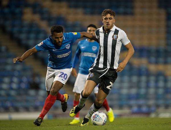 Gillingham’s Bradley Stevenson challenges with Portsmouth’s Nathan Thompson Picture: Ady Kerry