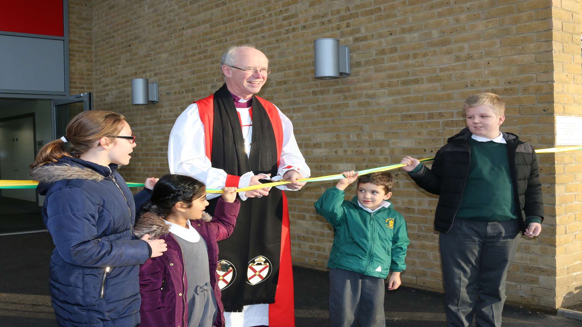 The Bishop of Rochester Rt Reverend James Langstaff opening new building extension at Stone St Mary's Primary School, with, from left, Denise Munro, Aisha Benning, Joliannes Lombard and Jack Logan.