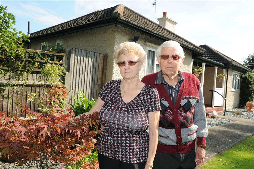 Janet Gifford & Bernard Carter outside their cottage