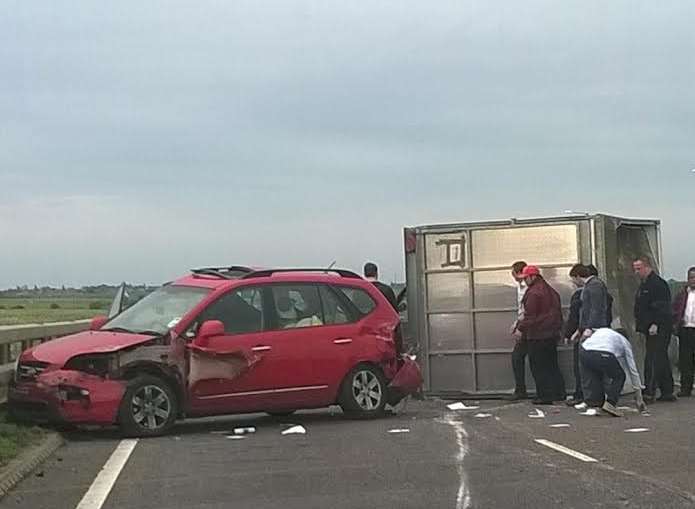 The car was towing a high-sided trailer