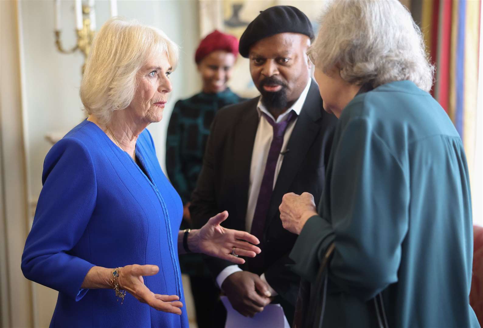Camilla chats with authors Sir Ben Okri and Penelope Lively during the Booker reception (Chris Jackson/PA)
