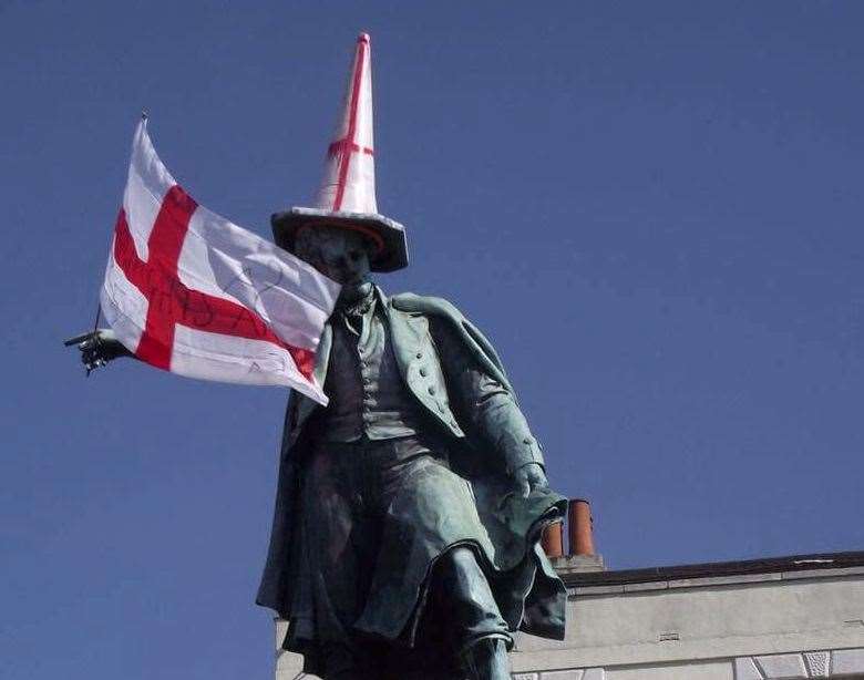 The Thomas Waghorn statue decorated in English regalia